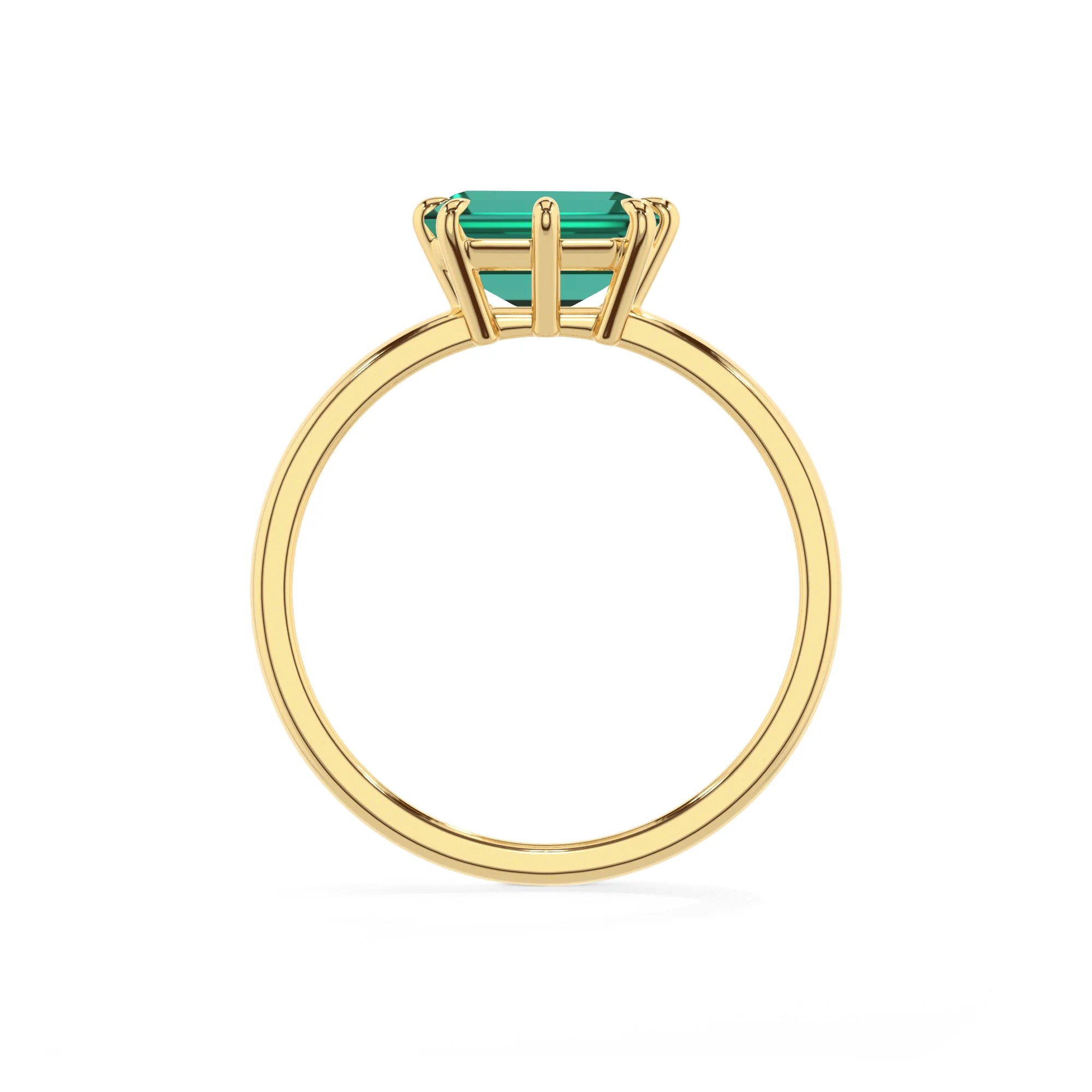 lab grown emerald octogon cut solitaire rings in yellow gold 
