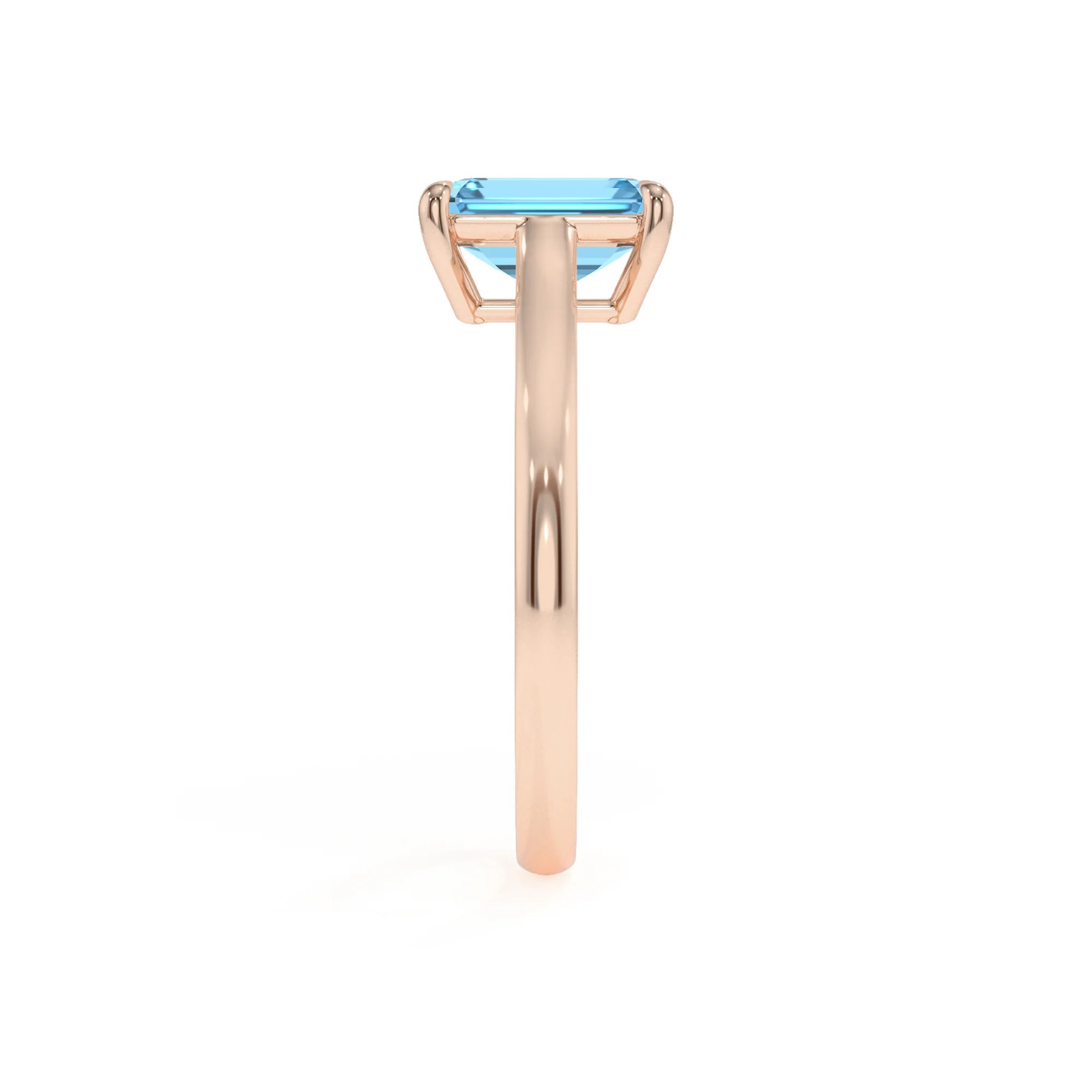 natural swiss-blue-topaz emerald cut solitaire rings in rose gold 
