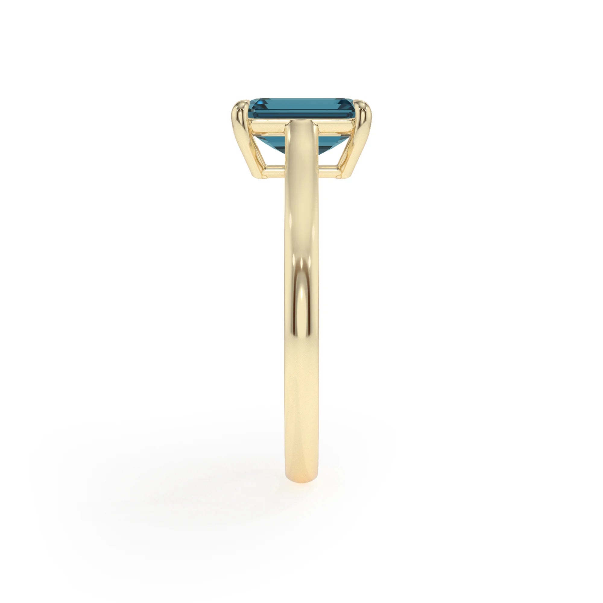 natural london-blue-topaz emerald cut solitaire rings in yellow gold 