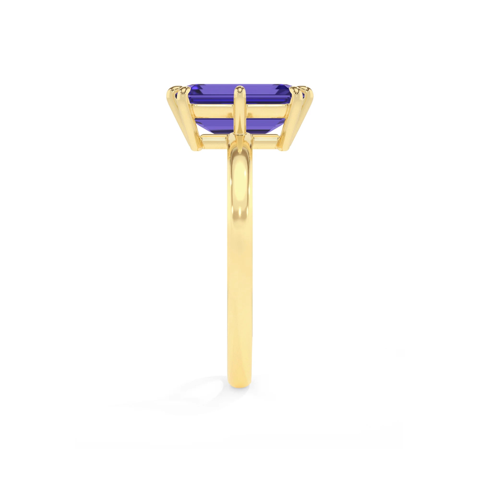 lab grown tanzanite emerald cut solitaire rings in yellow gold 