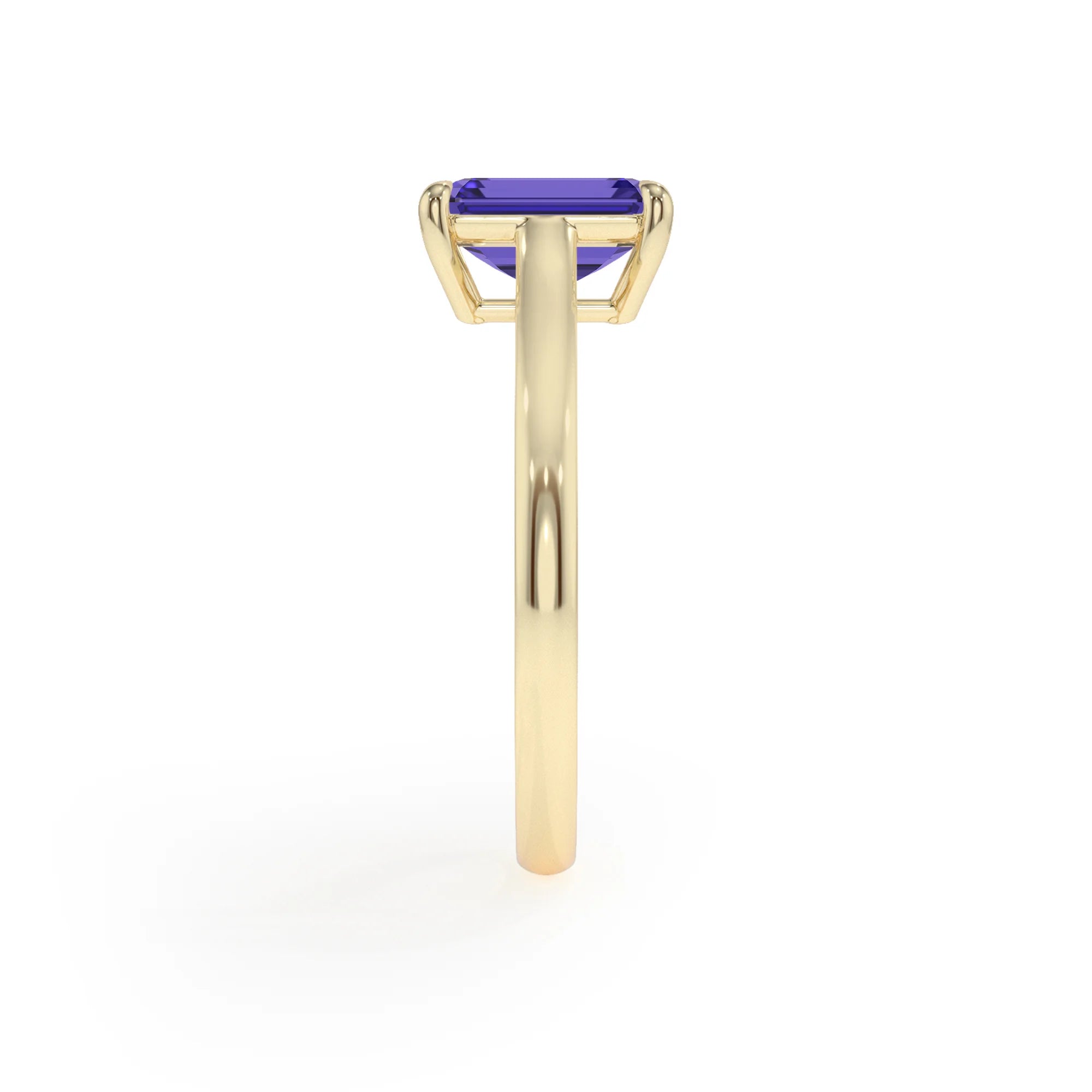 lab grown tanzanite emerald cut solitaire rings in yellow gold 