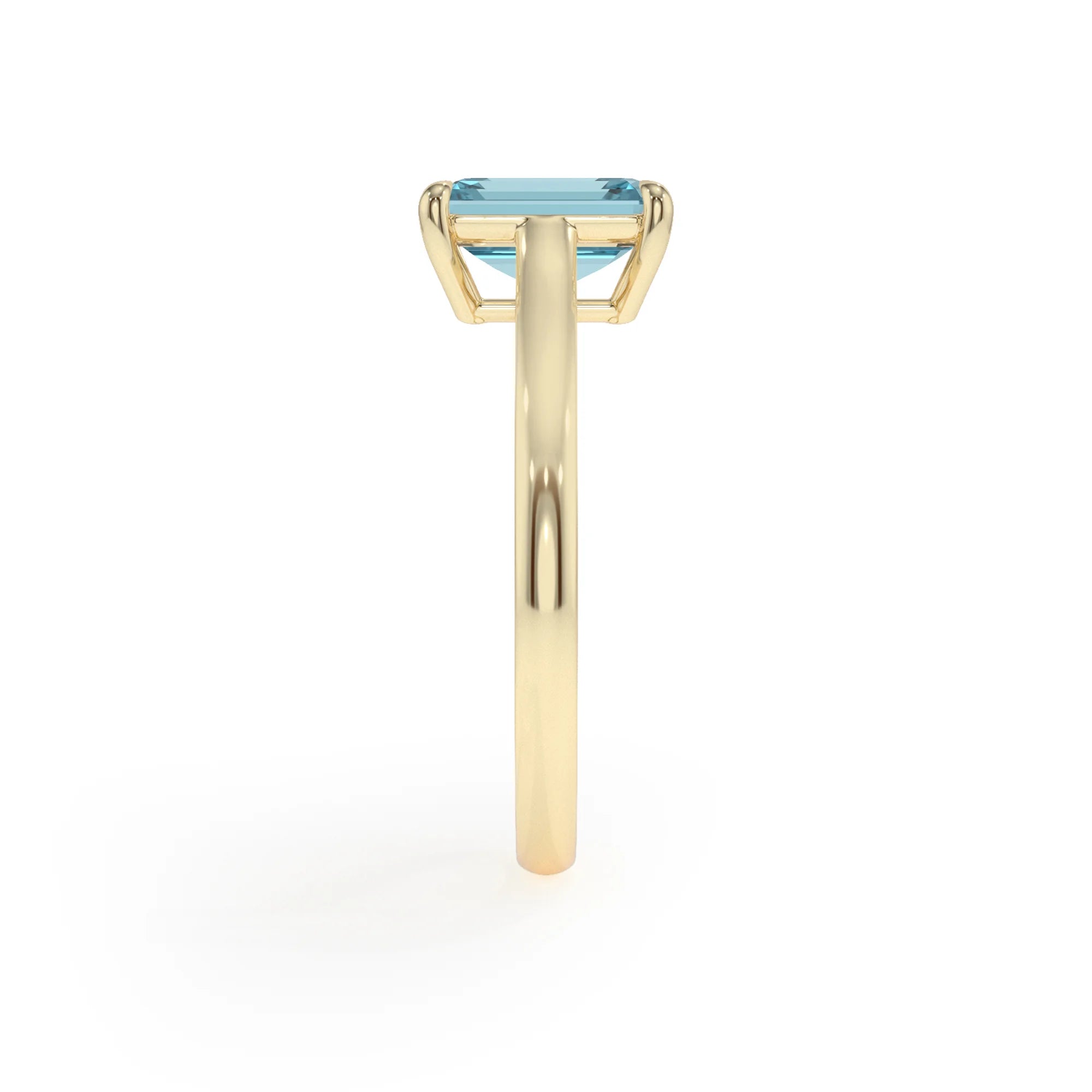 lab grown aquamarine emerald cut solitaire rings in yellow gold 
