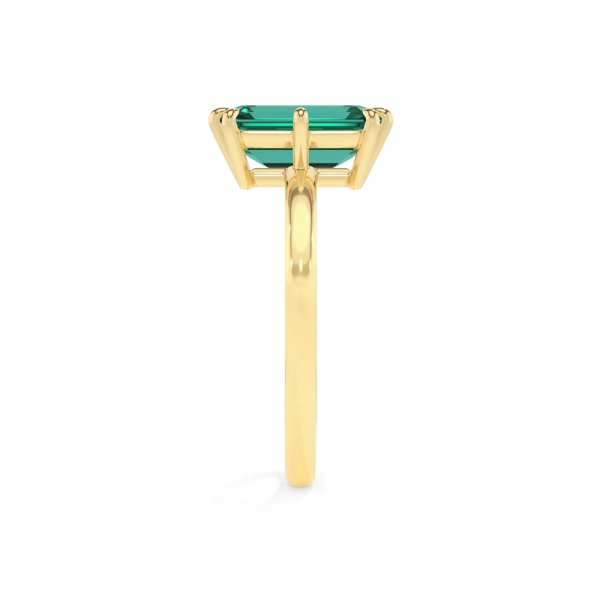 lab grown emerald octogon cut solitaire rings in yellow gold 