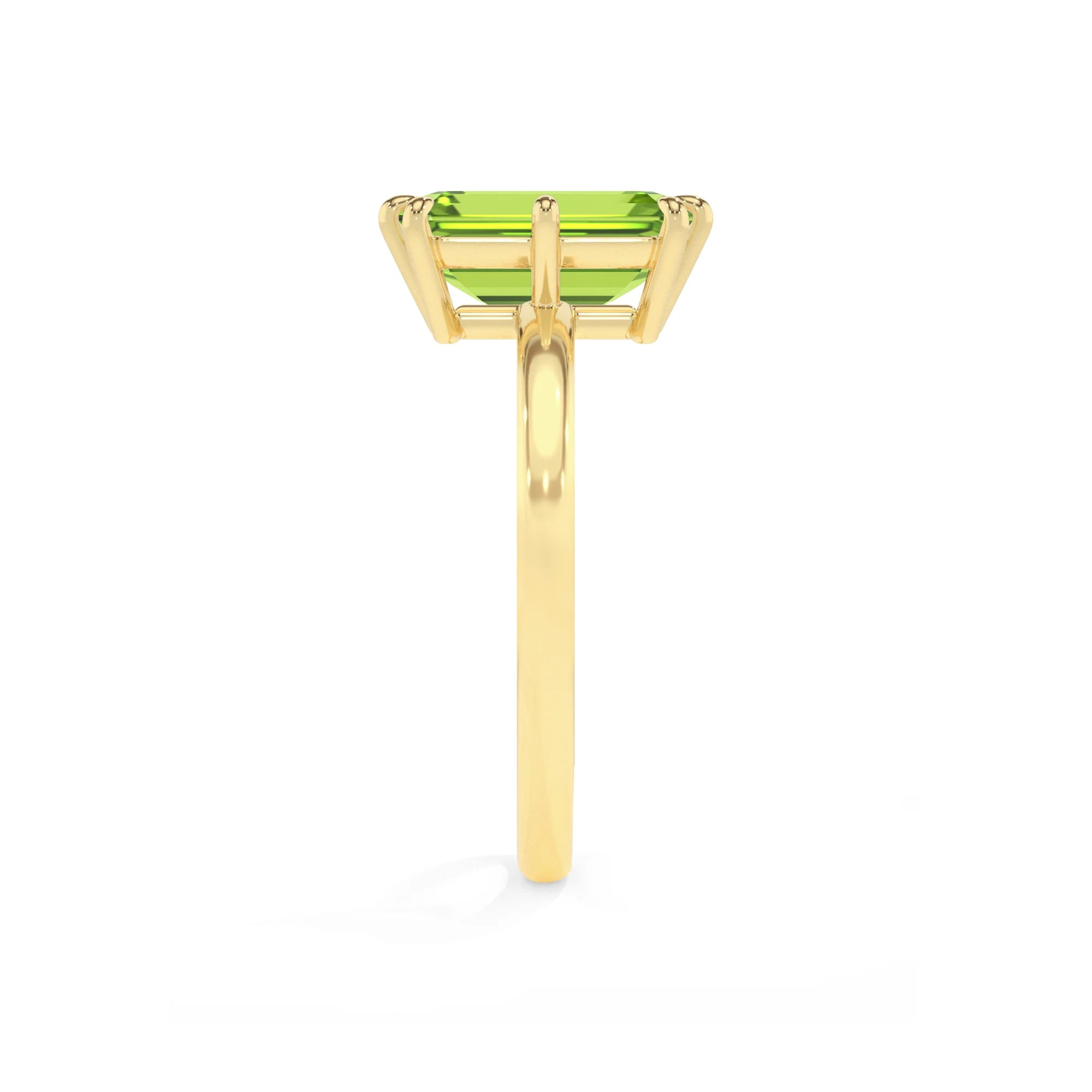 natural peridot emerald cut solitaire rings in yellow gold 